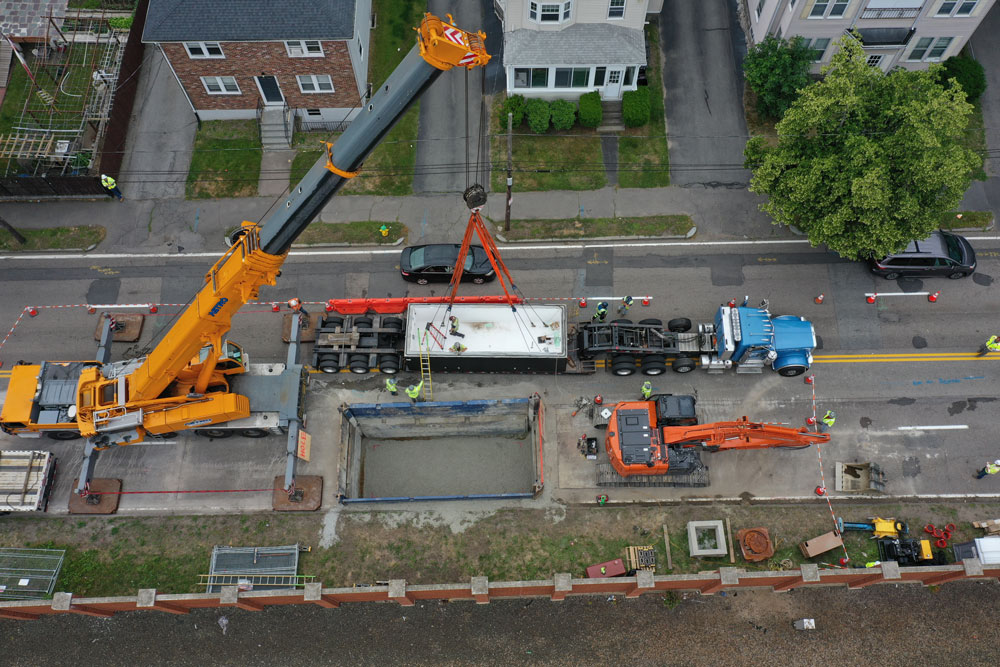 Aerial view of United Civil underground transmission installation crew managing multi-lane closures in an urban environment