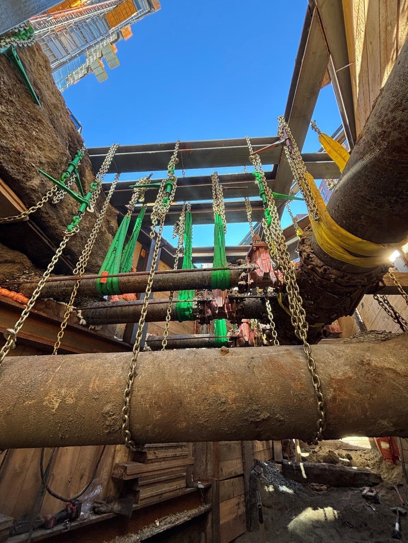 United Civil crew working inside a deep vertical shaft excavation during underground transmission cable installation